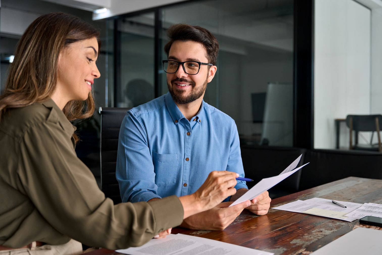 Smiling female financial advisor consulting client